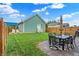 Spacious backyard with patio, lawn, and detached garage at 2015 Columbia Ave, Indianapolis, IN 46202