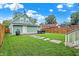 Green lawn, patio, and detached garage in backyard at 2015 Columbia Ave, Indianapolis, IN 46202