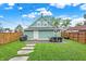 Backyard with patio, grill, and detached garage at 2015 Columbia Ave, Indianapolis, IN 46202