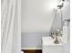 Clean bathroom with white vanity, shower, and a white tiled wall at 2015 Columbia Ave, Indianapolis, IN 46202