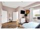 Bright bedroom with hardwood floors and built-in shelving at 2015 Columbia Ave, Indianapolis, IN 46202
