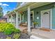 Inviting front porch with hanging plants and comfortable seating at 2015 Columbia Ave, Indianapolis, IN 46202