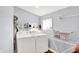 Bright laundry room, features washer, dryer, and ample storage at 2015 Columbia Ave, Indianapolis, IN 46202