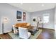 Bright living room with leather couch, wood coffee table, and hardwood floors at 2015 Columbia Ave, Indianapolis, IN 46202