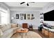 Finished basement recreation room with a large TV and comfy seating at 2015 Columbia Ave, Indianapolis, IN 46202