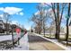 Paved path alongside residential street, some snow present at 2015 Columbia Ave, Indianapolis, IN 46202