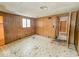 Bedroom with wood paneling and star patterned floor at 216 W 27Th St, Anderson, IN 46016