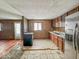 Kitchen with wood cabinets and stainless steel fridge at 216 W 27Th St, Anderson, IN 46016
