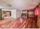 Living room with hardwood floors and brick fireplace at 216 W 27Th St, Anderson, IN 46016