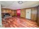 Living room with hardwood floors and brick fireplace at 216 W 27Th St, Anderson, IN 46016