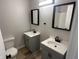 Updated bathroom with double vanity and gray cabinets at 2526 Pleasant W Way, Carmel, IN 46280