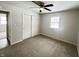 Comfortable bedroom with ceiling fan, closet, and access to another room at 2526 Pleasant W Way, Carmel, IN 46280