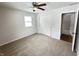Spacious bedroom featuring ceiling fan, sliding door closet, and hardwood floors at 2526 Pleasant W Way, Carmel, IN 46280