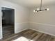 Dining Room features wood-look floors and modern light fixture at 2526 Pleasant W Way, Carmel, IN 46280