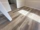 Modern dining room with new wood-look vinyl plank flooring at 2526 Pleasant W Way, Carmel, IN 46280