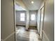 Bright entryway with wood-look floors and coat closet at 2526 Pleasant W Way, Carmel, IN 46280