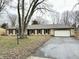 Ranch home with stone exterior, attached garage, and mature trees at 2526 Pleasant W Way, Carmel, IN 46280