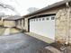 Attached garage with white door and stone exterior at 2526 Pleasant W Way, Carmel, IN 46280