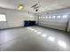 Attached garage with epoxy flooring and extra storage at 2526 Pleasant W Way, Carmel, IN 46280