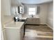 Modern kitchen with gray cabinets, quartz countertops, and stainless steel appliances at 2526 Pleasant W Way, Carmel, IN 46280