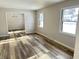 Living room with wood-look floors and view into dining room at 2526 Pleasant W Way, Carmel, IN 46280