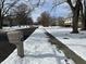 Residential street scene with snow-covered yards at 2526 Pleasant W Way, Carmel, IN 46280
