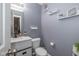 Modern bathroom with white vanity and toilet at 4046 Stubbington Ln, Indianapolis, IN 46239