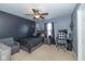 Cozy bedroom with a bed, desk, and seating area at 4046 Stubbington Ln, Indianapolis, IN 46239