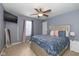 Bedroom with queen-size bed and full-length mirror at 4046 Stubbington Ln, Indianapolis, IN 46239
