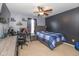 Spacious bedroom featuring a bed, workspace, and ceiling fan at 4046 Stubbington Ln, Indianapolis, IN 46239