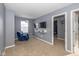 Bonus room with a comfy recliner and TV at 4046 Stubbington Ln, Indianapolis, IN 46239