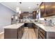 Modern kitchen with dark wood cabinets and granite countertops at 4046 Stubbington Ln, Indianapolis, IN 46239