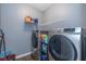 Laundry room with washer, dryer, and shelving at 4046 Stubbington Ln, Indianapolis, IN 46239