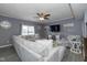 Spacious living room with large sectional sofa and flat-screen TV at 4046 Stubbington Ln, Indianapolis, IN 46239