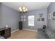 Home office with gray walls, carpet, and built-in desk at 4046 Stubbington Ln, Indianapolis, IN 46239