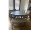 Dining area with a triangular table and matching bench seating at 448 N Gray St, Indianapolis, IN 46201