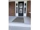 Black front door with a security screen and gray mat at 448 N Gray St, Indianapolis, IN 46201