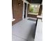 Painted porch with brick columns and a security door at 448 N Gray St, Indianapolis, IN 46201