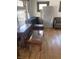 Living room with hardwood floors and a glass-top coffee table at 448 N Gray St, Indianapolis, IN 46201