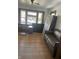 Spacious living room with hardwood floors and large windows at 448 N Gray St, Indianapolis, IN 46201