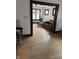 Living room features hardwood floors and a view into the dining area at 448 N Gray St, Indianapolis, IN 46201