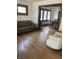 Living room with hardwood floors, a couch and view of dining area at 448 N Gray St, Indianapolis, IN 46201