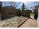 A private backyard with wooden fencing, complemented by a brick patio at 5060 Hawthorne Way # 11, Avon, IN 46123