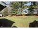 Lush backyard featuring mature trees providing privacy and natural beauty at 5060 Hawthorne Way # 11, Avon, IN 46123