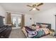 Bedroom with large windows, dresser, and king-size bed at 5060 Hawthorne Way # 11, Avon, IN 46123