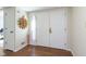 Bright entryway with hardwood floors and built-in shelving at 5060 Hawthorne Way # 11, Avon, IN 46123