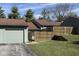 Charming townhouse featuring a private entry, garage, and a welcoming wooden fence and landscape at 5060 Hawthorne Way # 11, Avon, IN 46123