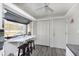 Kitchen breakfast bar with two stools and a view to backyard at 5060 Hawthorne Way # 11, Avon, IN 46123
