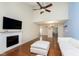 Bright living room with fireplace, hardwood floors, and vaulted ceiling at 5060 Hawthorne Way # 11, Avon, IN 46123