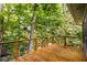 Inviting back deck surrounded by lush green trees at 5508 Bay Landing Cir, Indianapolis, IN 46254